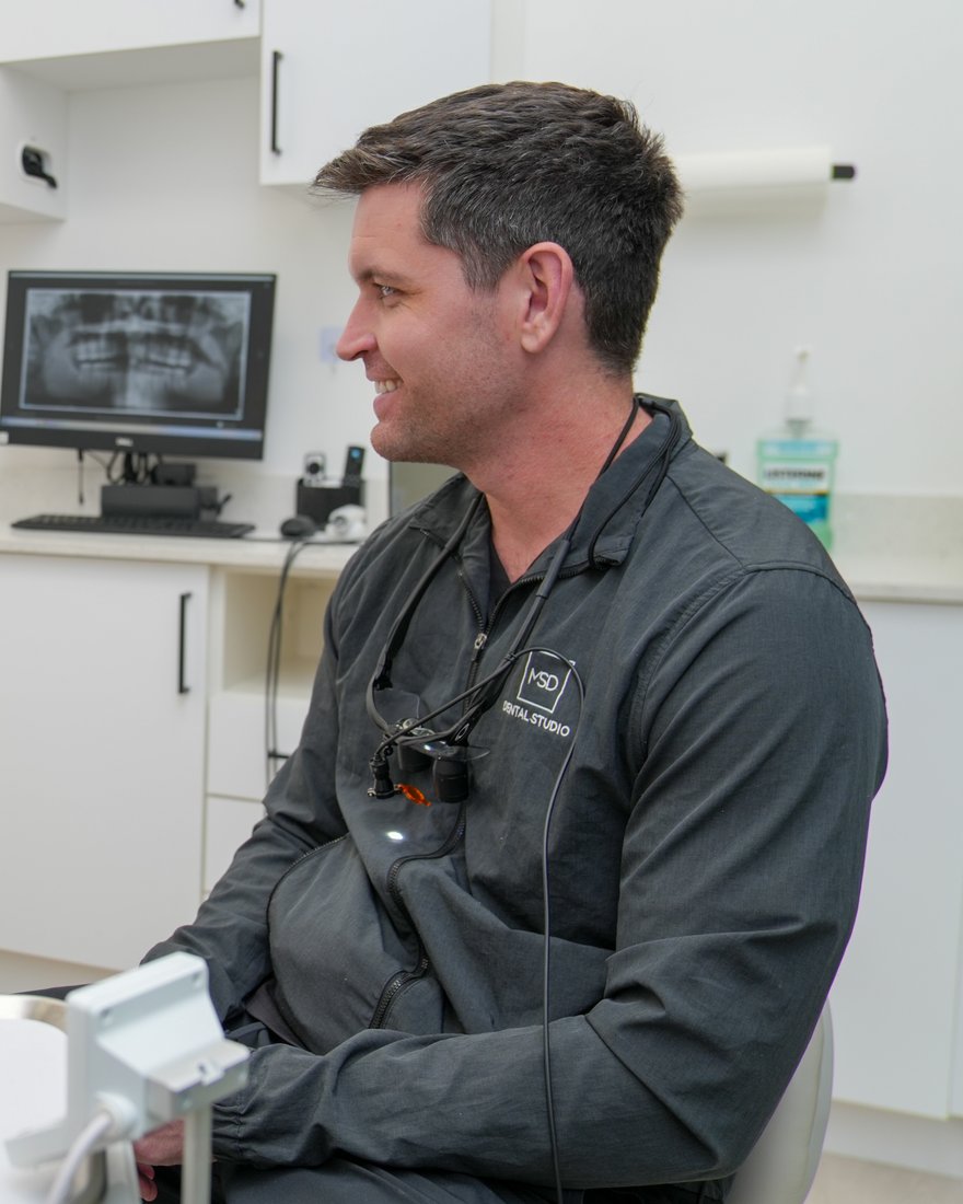 Dr. Matthew Dillon reviewing a patient’s X-rays on screen at MSD Dental Studio in Coral Springs, FL