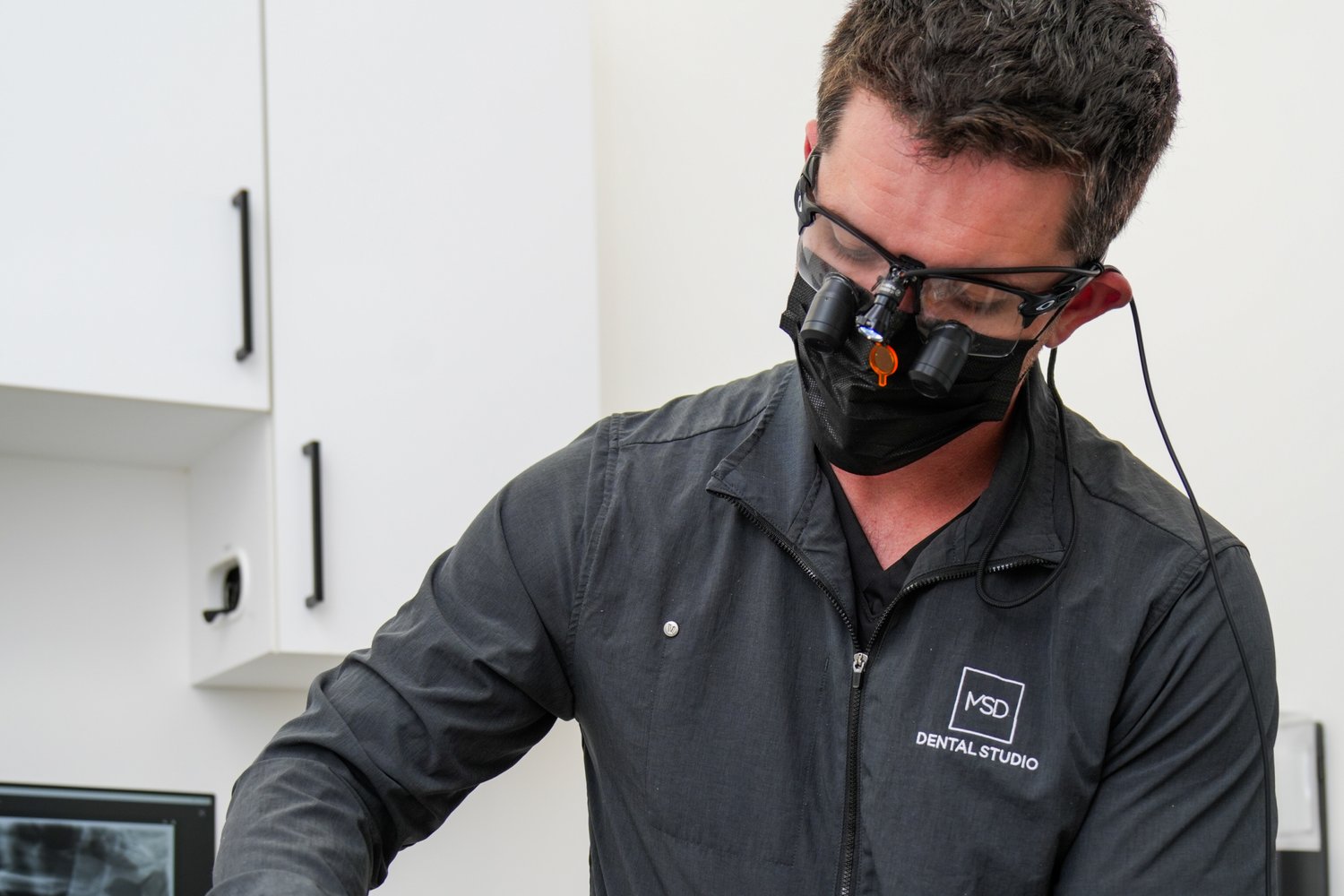 Dr. Matthew Dillon placing a dental implant with precision at MSD Dental Studio, Coral Springs
