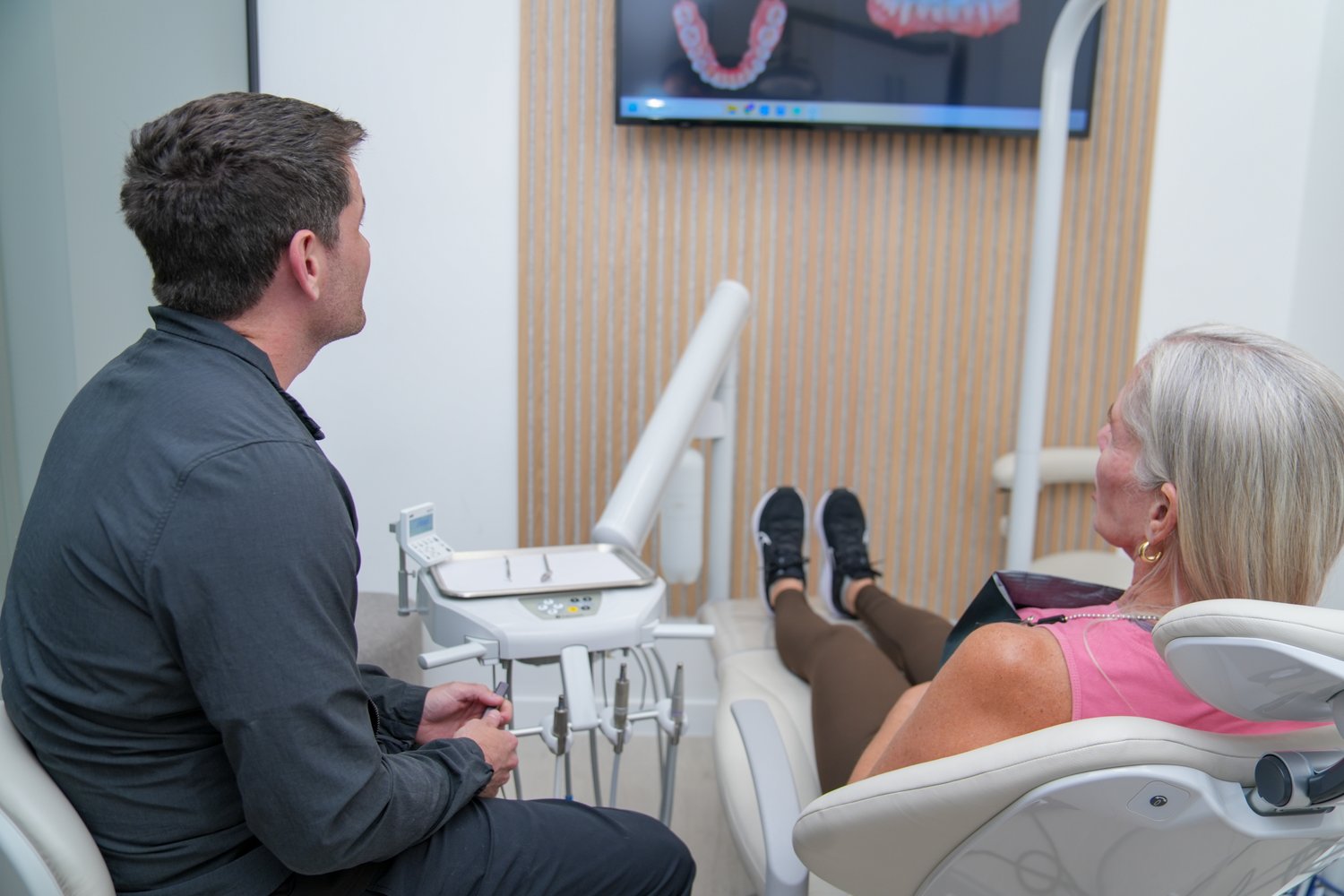 Dr. Matthew Dillon talking with a patient before a checkup at MSD Dental Studio, Coral Springs
